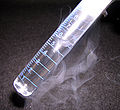 Argon ice and liquid in a small graduated cylinder