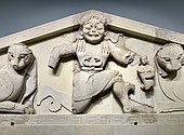 Fig. 6. Winged snake-haired Gorgon (Medusa) with belt of snakes, in kneeling-running position, with her offspring Pegasus (left) and Chrysaor (right) at her side, and flanked in Mistress of Animals style by a pair of lions; pediment from the temple of Artemis in Corfu, Archaeological Museum of Corfu (early sixth century BC)[71]