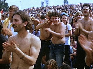 The crest of the counterculture wave in the United States: the three-day 1969 outdoor rock concert and gathering known as Woodstock.