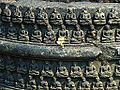 Details on one of numerous votive stupas at the site