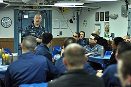 US Navy 110329-N-SF508-120 Master Chief Joseph Fahrney, command master chief of Commander, Task Force 70, speaks to Sailors on the mess decks of th.jpg