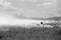 A fisherman on the shore near the dam, 1961