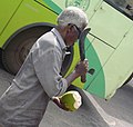 Cutting a tender coconut.