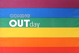 LGBTQ multicolored rainbow flag and Coming Out Day text (51909555464).jpg