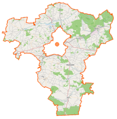 Mapa konturowa powiatu radomskiego, u góry po prawej znajduje się punkt z opisem „Pionki”