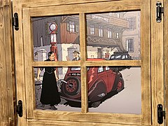 Dans la Vieille Douane à Châtel, un dessin de Jérôme Phalippou représentant la pompe à essence du Curé Milloux, ici s'apprêtant à faire le plein pour une Peugeot 202.