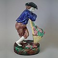 Coloured glazes majolica figural vintager, c. 1875, naturalistic in style