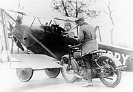 Nassau County Deputy Sheriff tickets Lawrence Sperry after landing plane in street, Circa 1922.[11]