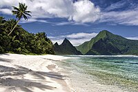 A white sand beach and verdant peaks