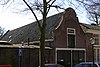 Baljuwhuis, koetshuis en muur