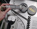 Radioactive emissions from 22 Na being measured with a Geiger counter.