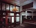 Entrance hall with inscription that reads "Who Earns Money Is God's Beloved"[42]