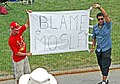 Disgruntled fans with a "Blame Mosley" banner during the race