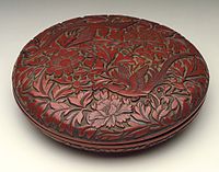 He (Box) with Pair of Pheasants in Peonies, late Ming, 19 cm wide. Thin top layers of red over black give effective contrasts.