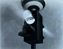 A black and white illustration of the Panda crossing beacon showing a stop signal to traffic