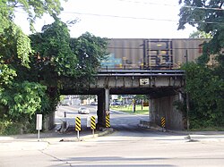 A freight train crossing a railway bridge at the south end of Scarlett Road