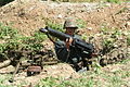 MG body being mounted on a tripod by a modern re-enactor