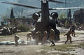 Pakistani Soldiers carry tents away from a U.S. Army CH-47 Chinook helicopter that was there on October 19. The United States took part in the multinational effort to provide humanitarian assistance and support to Pakistan and Afghanistan following the devastating October 8 earthquake.