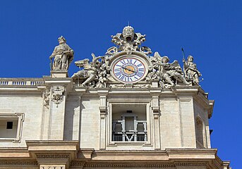 Clock on the top of facade (right)