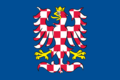 Die historische Flagge Mährens in Form eines blauen Blattes mit einem weiß-rot geschachten Adler mit gelber Krone und Bewehrung