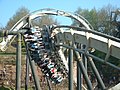 A Bolliger & Mabillard Inverted Roller Coaster train seats riders 4 across.