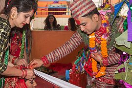 Procession of Nepali Hindu Wedding; groom wears Dhaka dress used only by Khas Parbattia community