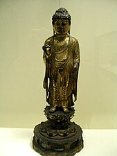 Buda de pie. Período de Silla Unificada, siglo VII, c. 700. bronce dorado, altura 47.3 cm. Museo Asiático de San Francisco. Colección Avery Brundage.