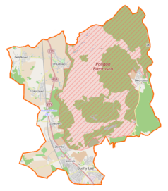 Mapa konturowa gminy Suchy Las, blisko centrum na lewo u góry znajduje się punkt z opisem „Chludowo”