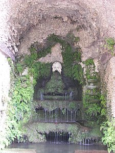 Mask spouting water in the Grotto of Pomona