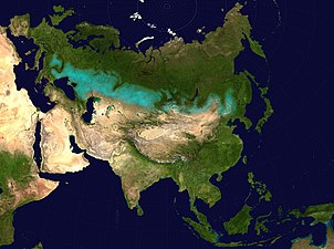 Pás eurasijských travnatých stepí (modravou barvou)