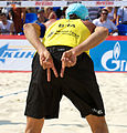 Image 20Brazil's Emanuel Rego signals for an "angle" block for the opposing player on the left and a "line" block for the opposing player on the right (from Beach volleyball)