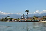 View of a colonial-era town with a church at the coast