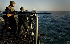 US Navy 030316-N-3783H-244 Sailors aboard the guided missile cruiser USS Shiloh (CG 67) fire a .50 caliber machine gun during a surface-threat drill.jpg