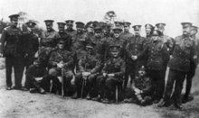 Soldiers in British uniforms of First World War vintage pose for a formative shot