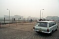 East German officer checks a car returning to East Berlin, November 1989.