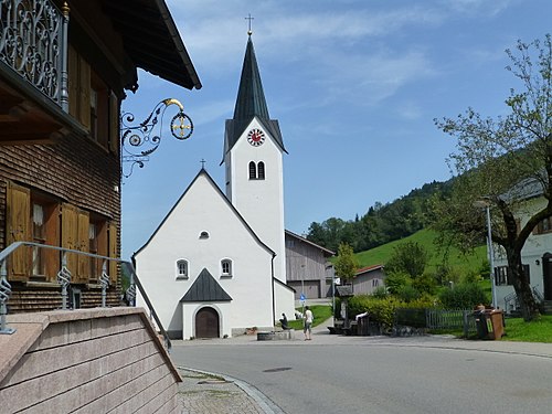 House am Kreuz and church in Aach, district Oberallgäu, frontier Bavaria-Vorarlberg.
