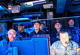 Japanese Maritime Self-Defense Force Vice Adm. Yasushi Matsushita, the commander in chief, and Vice Adm. Ikeda Tokuhiro, the commander of the Fleet Escort Force, watch a presentation during a visit to the guided 140228-N-NE138-5205.jpg