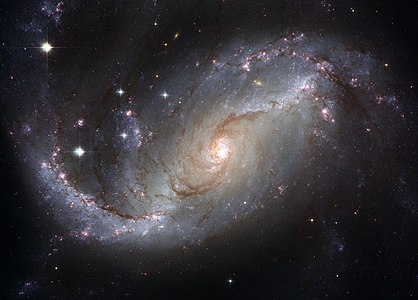 NGC 1672: Kılıçbalığı takımyıldızı'nda bulunan çubuklu sarmal gökada (Üreten: NASA, ESA)