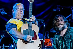 Tenacious D playing guitars onstage