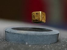 A magnet is suspended over a liquid nitrogen cooled high-temperature superconductor (−200 °C)