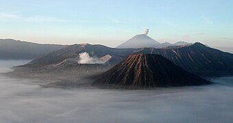 Mount Bromo at sunrise, showing its volcanoes and Mount Semeru (background)