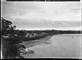 View of St Heliers Bay, Auckland, taken from Cliff Road looking west. St Heliers Bay Hotel and wharf are in the middle distance. Photographed by William Archer Price between 1910 and 1930.