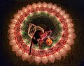 Thumbnail for File:Woman lighting the candles for the Festival of Lights in India (cropped).jpg