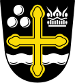 Gemeinde Häder In Schwarz ein durchgehendes goldenes Kleeblattkreuz, unten unterlegt von einem silbernen Wellenbalken; in den oberen Winkeln drei, eins zu zwei gestellte silberne Steine und eine mit goldenen Steinen besetzte silberne Krone.