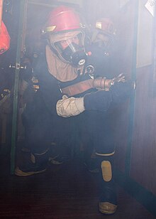 US Navy 070202-N-0577G-015 Information Systems Technician 3rd Class Jason R. Shupe enters the chiefs' mess aboard guided missile destroyer USS The Sullivans (DDG 68).jpg