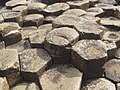 Naturally formed basalt columns from Giant's Causeway in Northern Ireland; large masses must cool slowly to form the polygonal fracture pattern