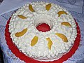 Argentine homemade cake with whipped cream and peaches