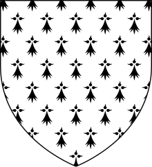 A shield shape. Inside the shield is a white background with black ermine symbols.