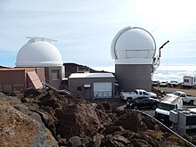 Starr-141106-2755-Dubautia menziesii-habitat view Pan Starrs telescopes-Science City-Maui (25130256292).jpg