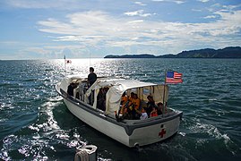 US Navy 080611-N-9689V-001 Filipino translators and volunteers wave goodbye as they depart the Military Sealift Command hospital ship USNS Mercy (T-AH 19), on the last Band Aid boat.jpg